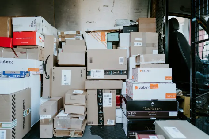 The inside of a delivery van packed with parcels ready for a last-mile round, from many different senders.